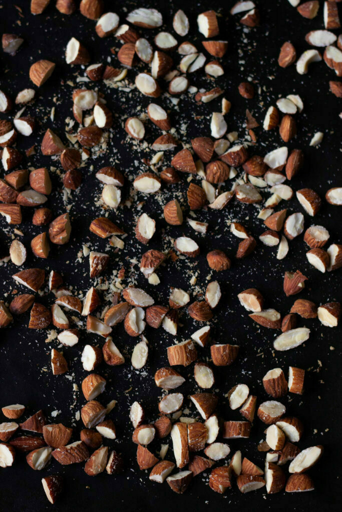 Chocolate almond biscotti plated with extra nuts and chocolate shavings
