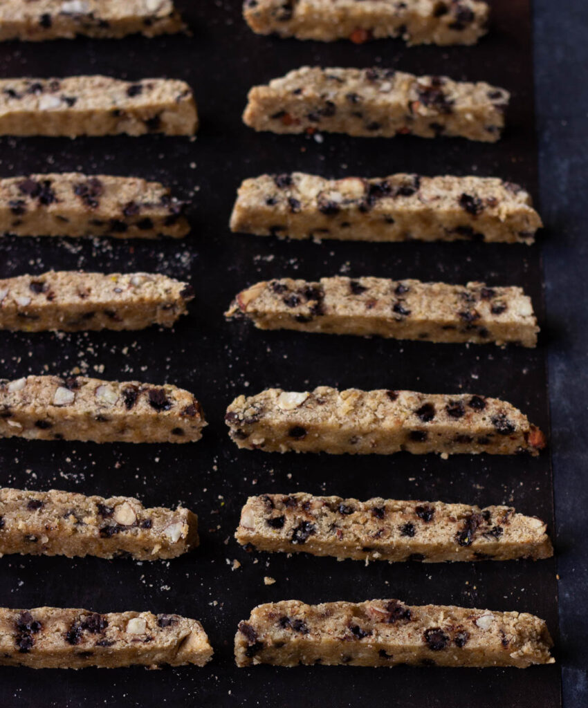 Close-up of crispy biscotti with chunks of almonds and chocolate