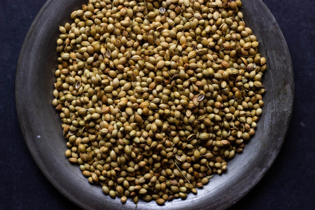 Close-up of whole coriander seeds before roasting