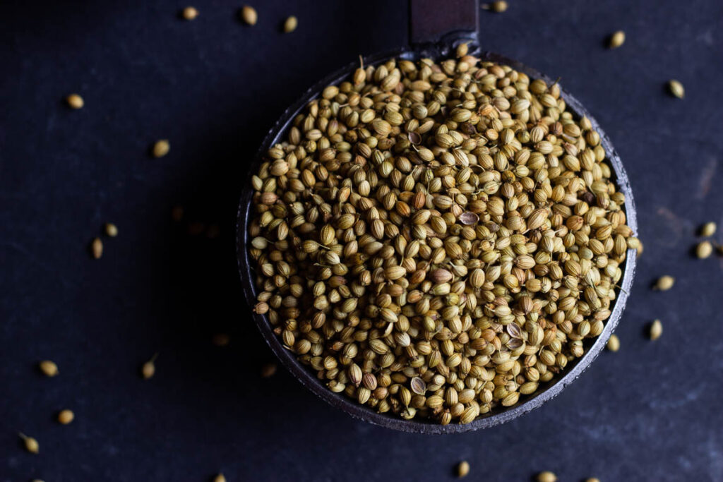 Freshly ground coriander powder in a glass bowl