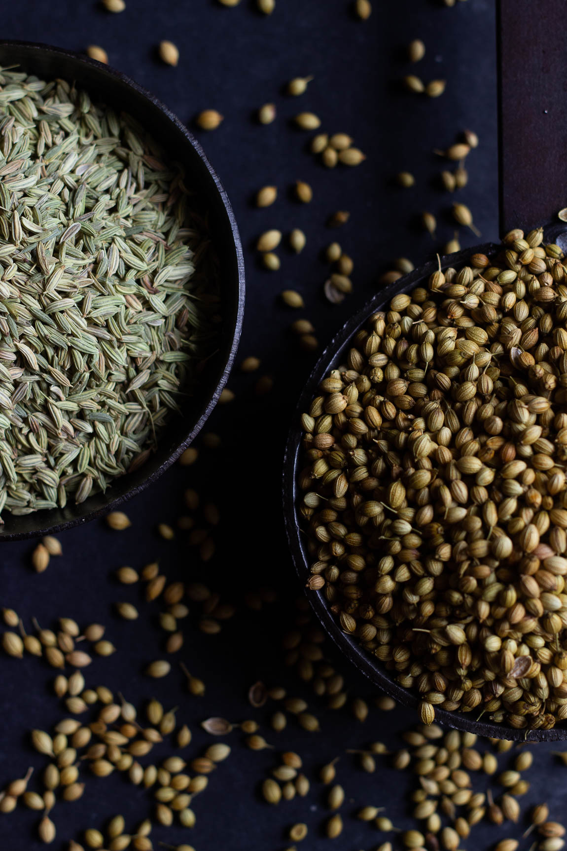 Close-up view of funnel seeds in a bowl with the spoon inside it