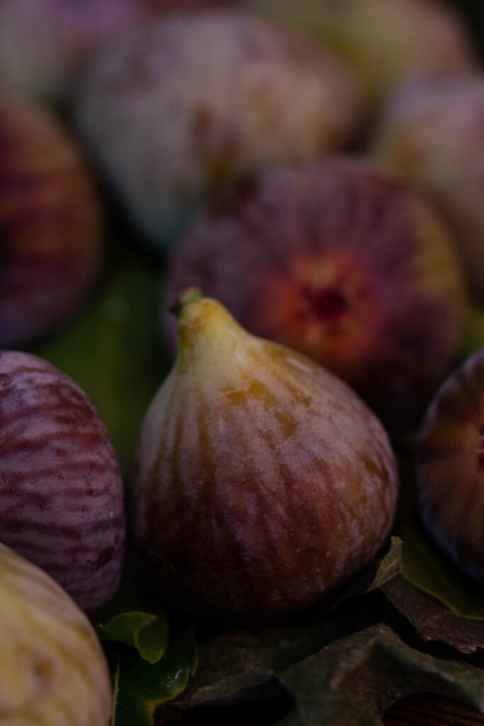 A stack of dried figs in a rustic setting, showing their high fiber content and sweetness