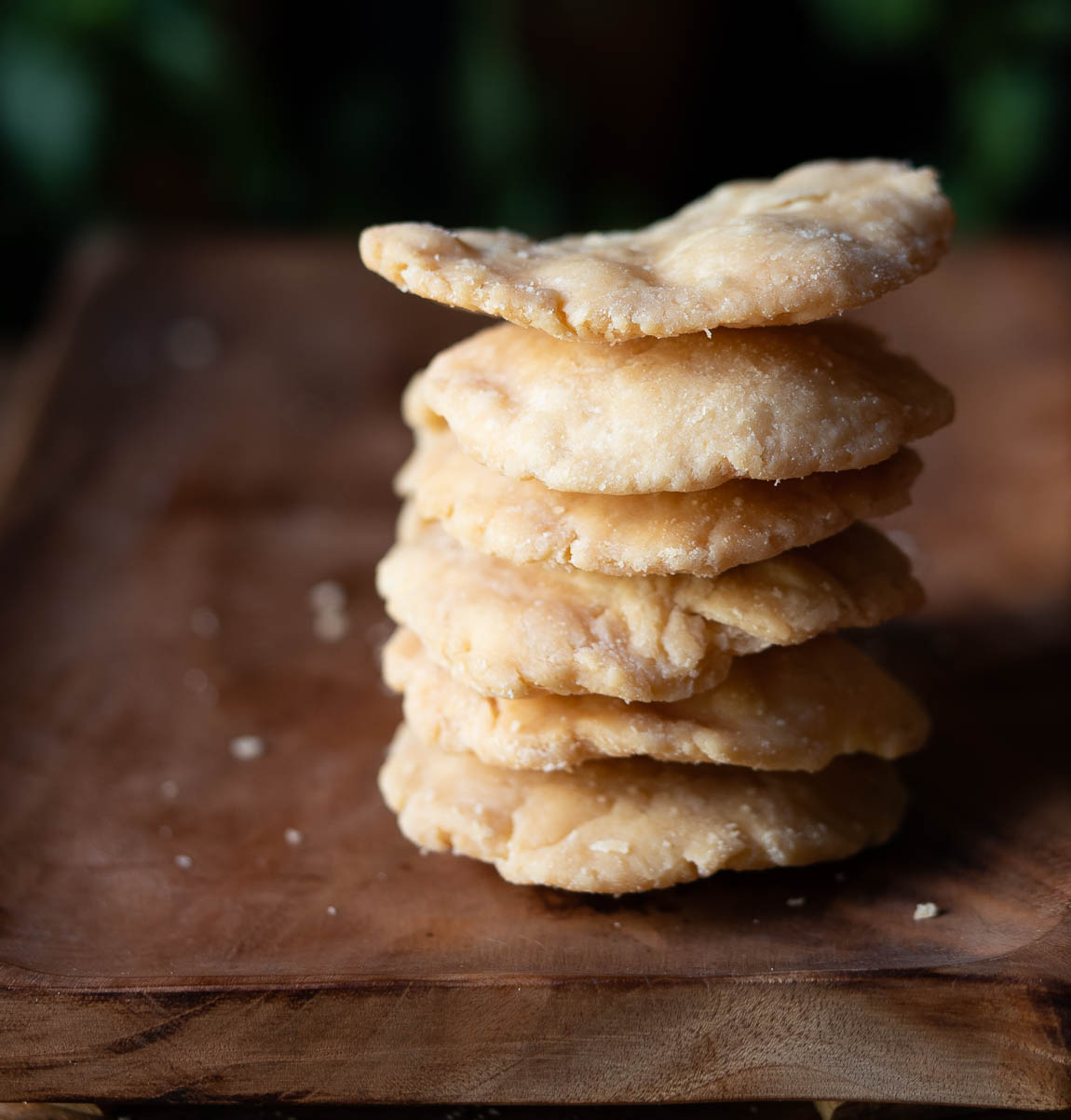 Close-up of a stack of golden-brown crispy Mathri with visible flaky layers