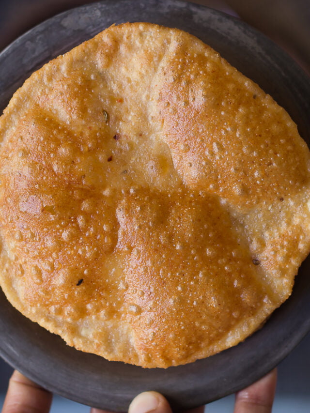 Close-up of a freshly fried Bedmi Puri showing its crispy texture