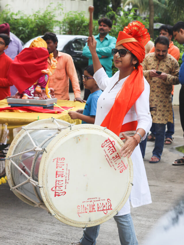 Me with a pair of dhol sticks and joined our society’s pathak