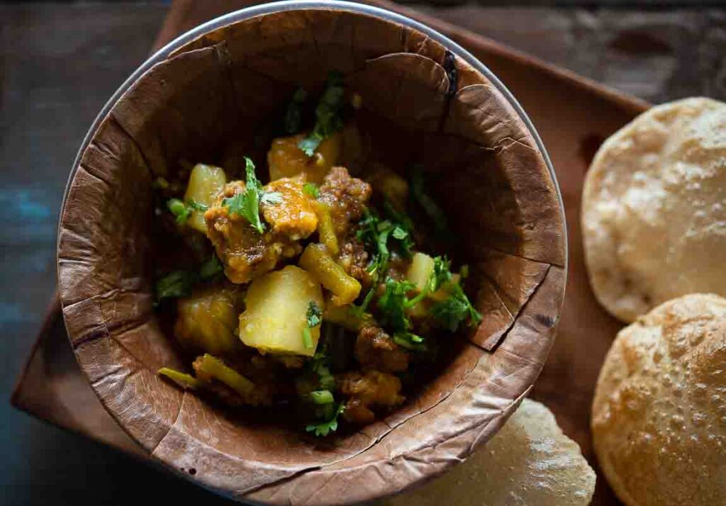 Homemade singri aloo ki sabzi cooked with mogri and potatoes