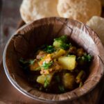 Homemade singri aloo ki sabzi cooked with mogri and potatoes